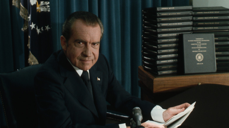 Nixon with transcripts of Oval Office tapes